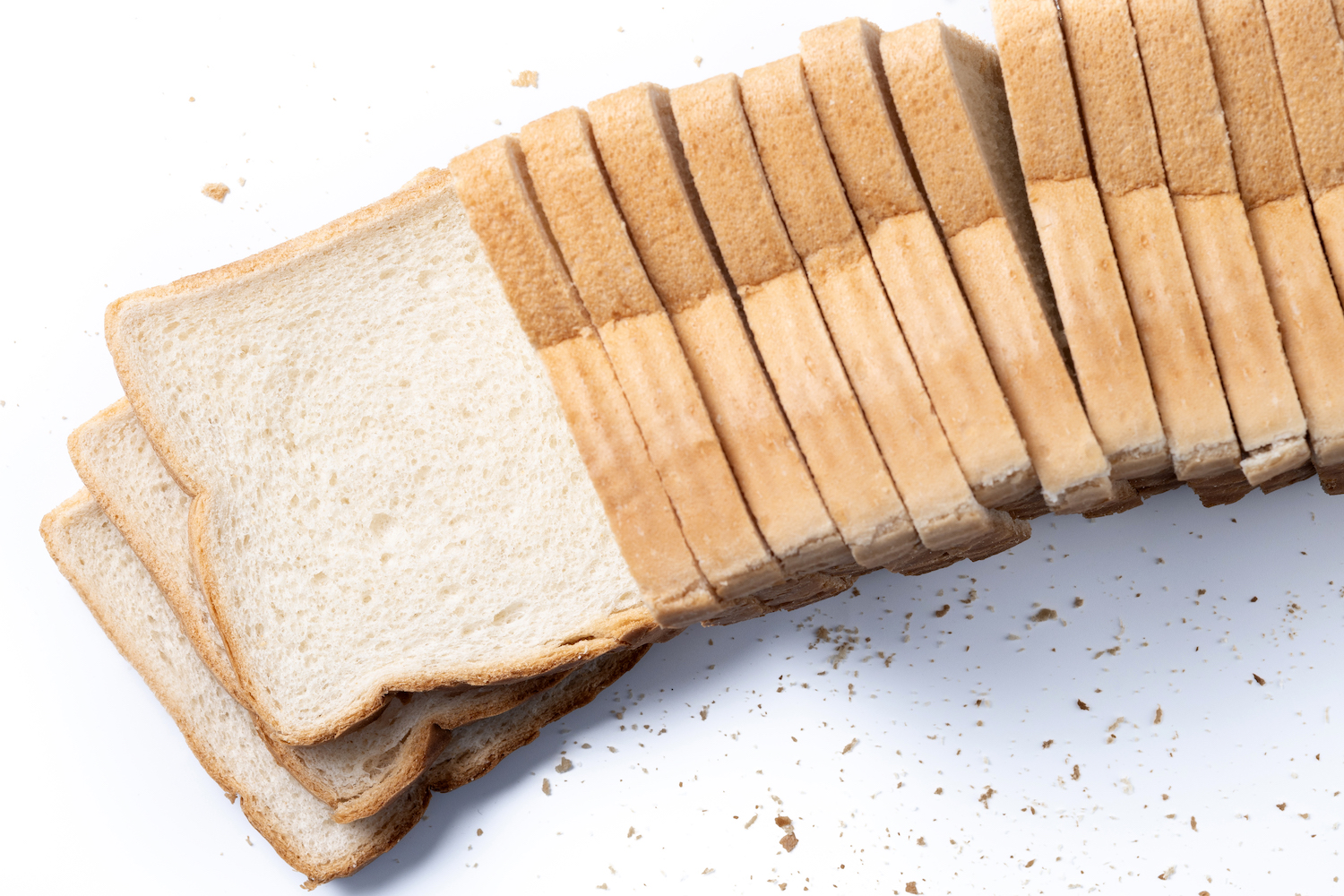 Sliced bread arranged in a neat row.